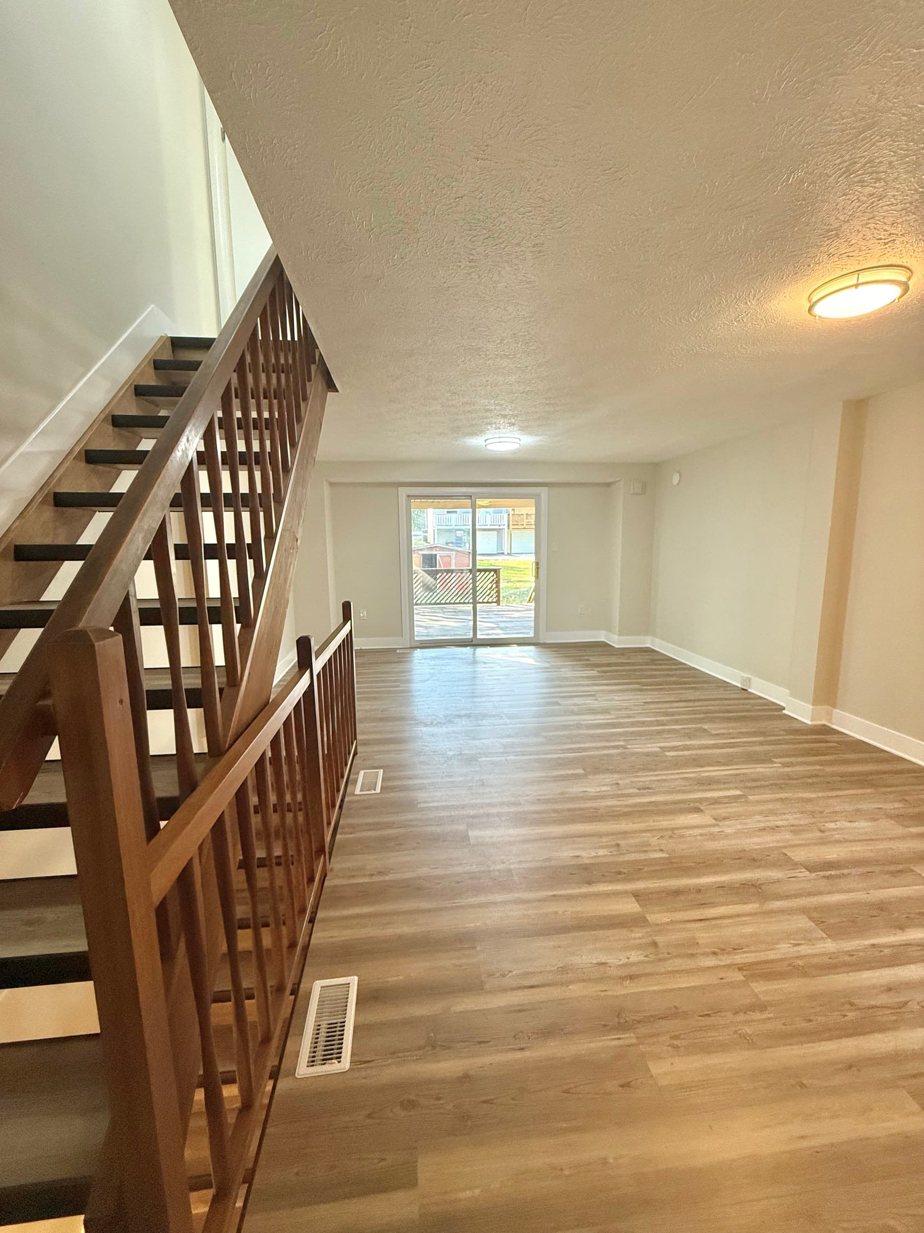 Moon Township living room after remodel with luxury vinyl plank flooring and an open layout